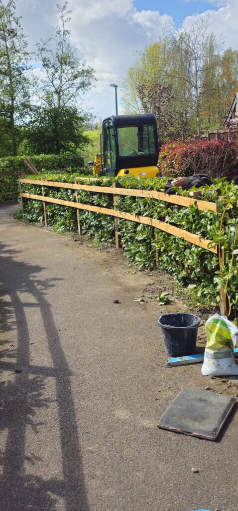New post and rail fencing along a front garden