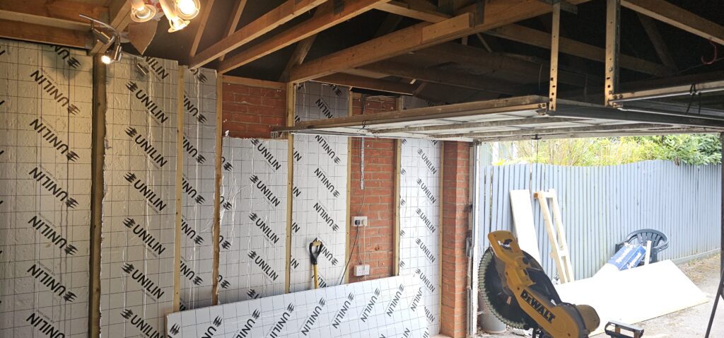 Garage conversion with insulated walls going in