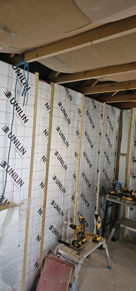 Garage conversion with insulated walls going in