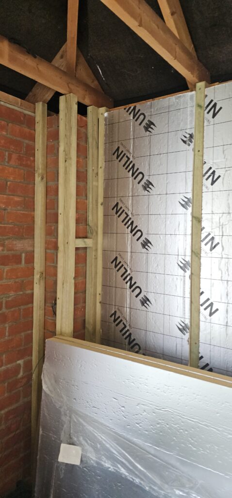 Garage conversion with insulated walls going in