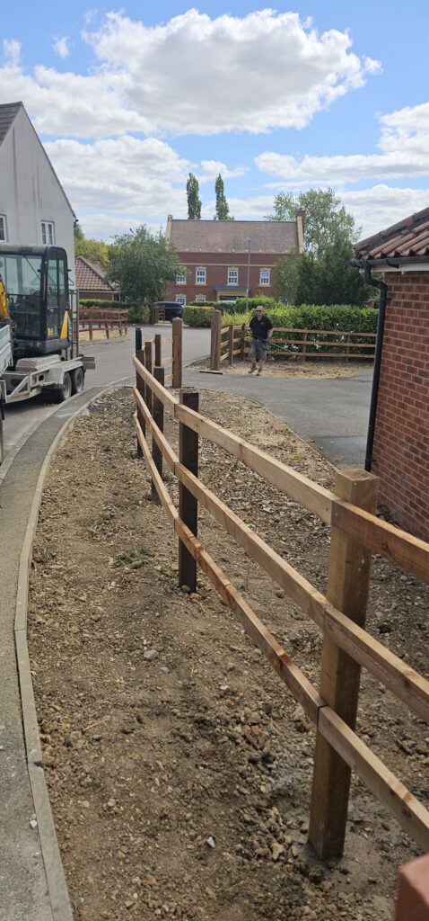 New post and rail fencing along a front garden