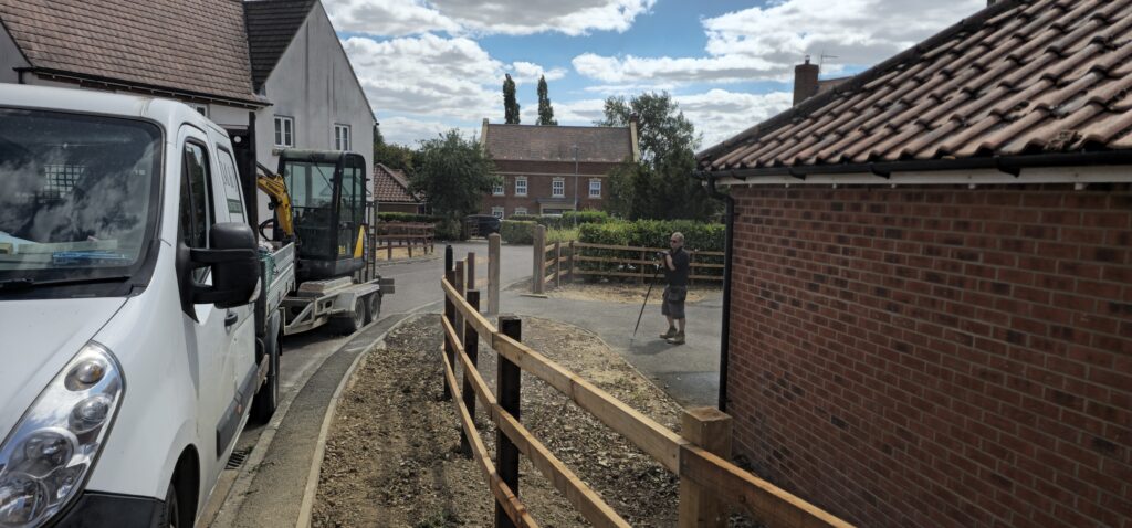 New post and rail fencing along a front garden