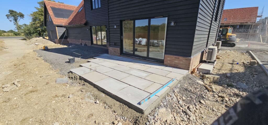 Sandstone patio being laid by M&J Construction