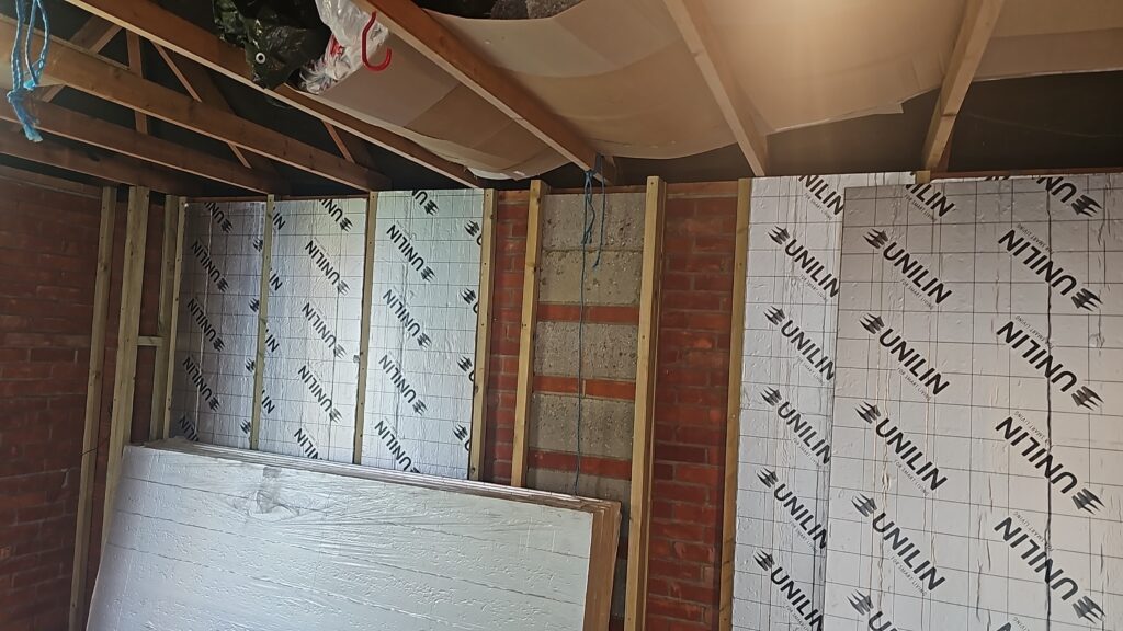 Garage conversion with insulated walls going in