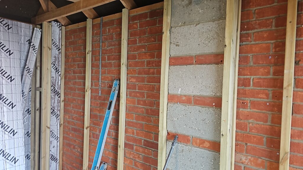 Garage conversion with insulated walls going in