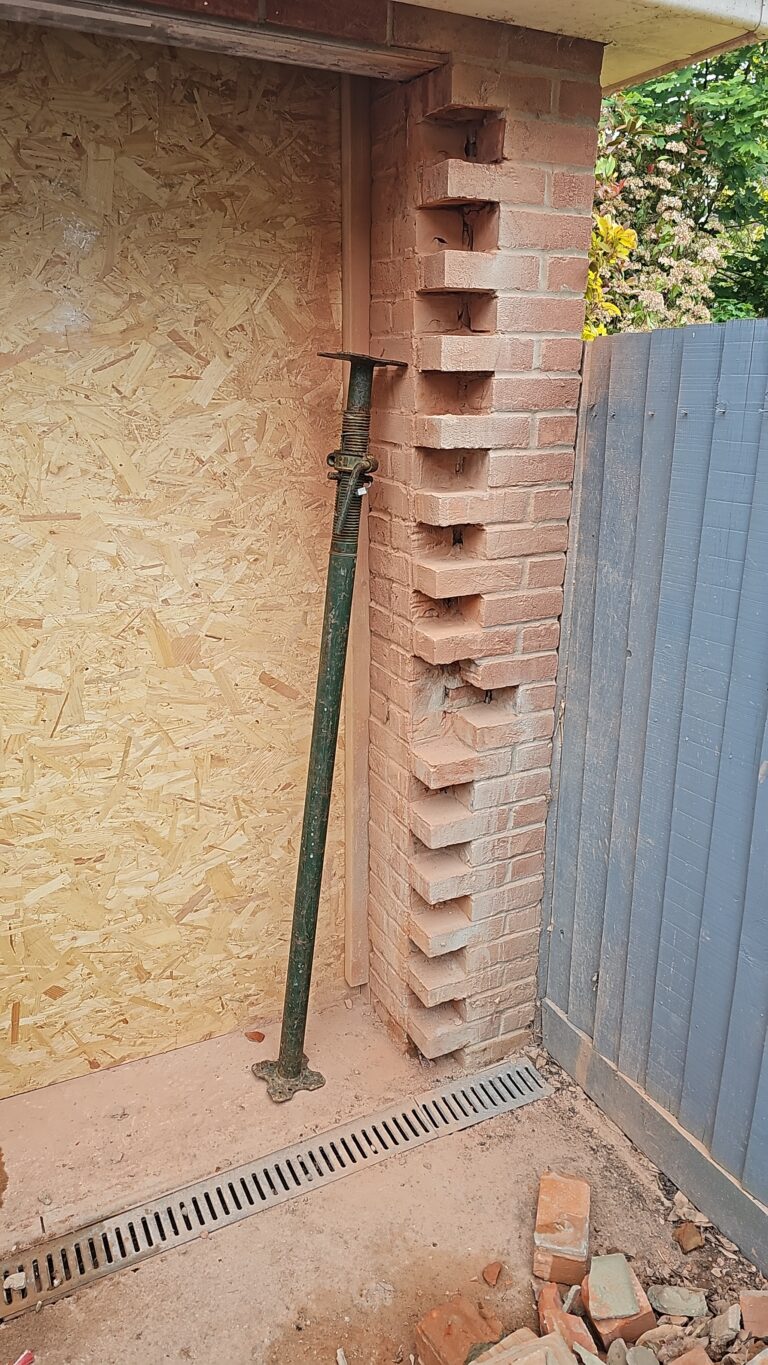 Brickwork and steel prop during a garage conversion